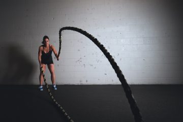 person working out with ropes